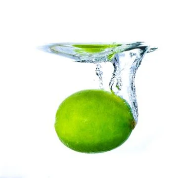 Lime splashing Stock Photos