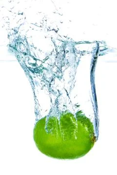 Lime splashing Stock Photos