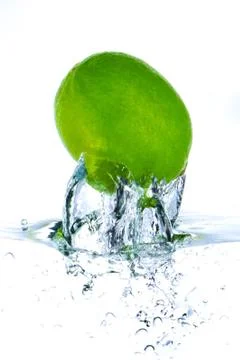 Lime splashing Stock Photos