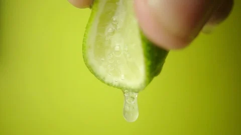 A lime squeezed in slow motion Stock Footage 89188886