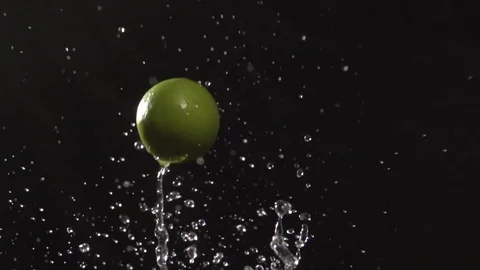 Lime throw up with water splash droplets slow motion macro Stock Footage 124735881