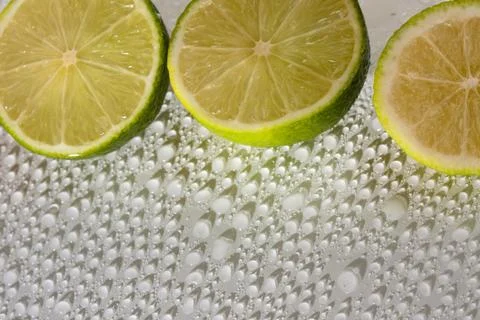 Lime with water drops Stock Photos