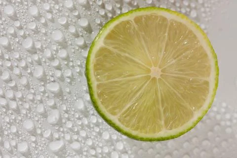 Lime with water drops Stock Photos