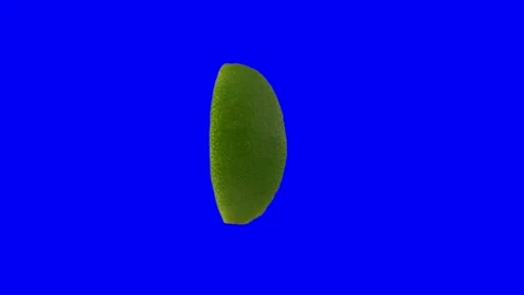 Lime wedge spin 360 degrees isolated on blue screen Stock Footage 144533901