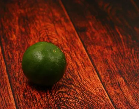 Lime on a wood table top Stock Photos