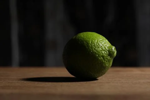 Lime on the wooden table. Close up Stock Photos