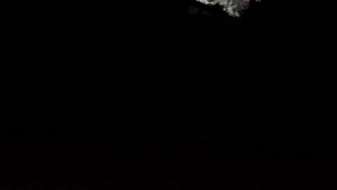 Limes fall into water in slow motion. on a black background Stock Footage 131037003