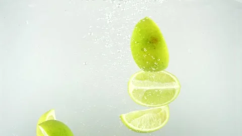 Limes Falling into the Water Stock Footage 249957811