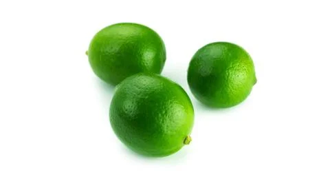 Limes on a white background. Stock Photos