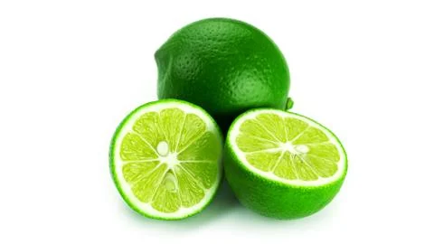 Limes on a white background. Stock Photos
