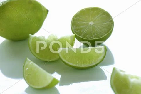 Limes, whole, halved and sliced Stock Photos