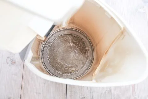 Limescale, lime scale in old kettle in kitchen. A white, chalky residue of Stock Photos