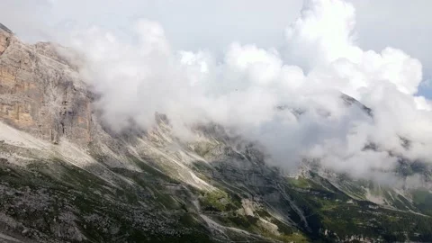 Limestone Alp landscape drone shot with clouds embracing the rocks Stock Footage 224541413