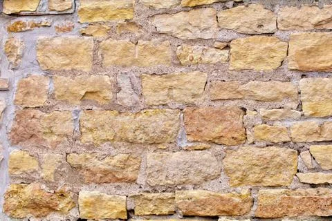 Limestone block wall with cement closeup as background Stock Photos