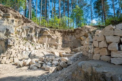 Limestone blocks. Quarry surrounded by forest. Rocky cliff. Jozefow, Roztoc.. Stock Photos