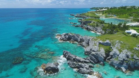 Limestone bluffs below a green Bermuda headland Stock Footage 91157043