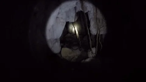 Limestone cave adventures : Exploring a cave in Madagascar near Morondova Stock Footage 94000875