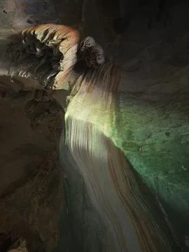 A limestone cave interior with stalactites and flowstone, Thailand Stock Photos