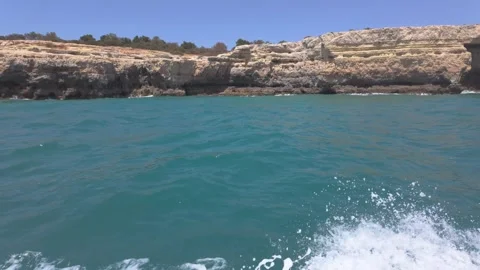 Limestone Cliffs and caves of the coast of Albufeira Portugal Stock Footage 310368107