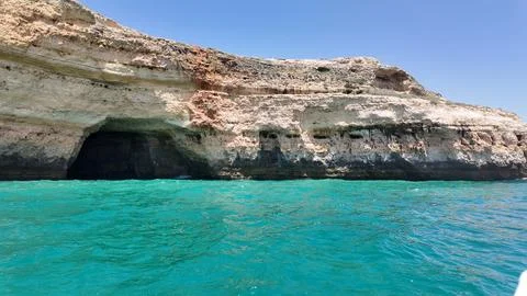 Limestone cliffs and caves off the coast of Albufeira Portugal Stock Photos