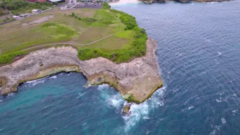 Limestone Cliffs and Churning Ocean at Devils Tears Stock Footage 328962003