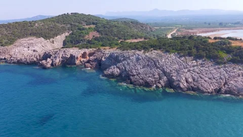 Limestone Cliffs and Turquoise Water at Voidokilia, Greece Stock Footage 343732940