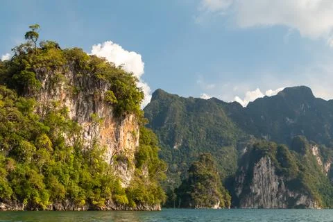 Limestone Cliffs covered in green forest in Khao Sok, Thailand Stock Photos