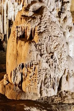 Limestone column formed by the junction of stalactites and stalagmites in a.. Stock Photos