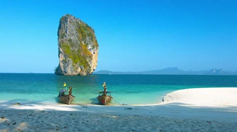 Limestone Formation and Longtail Boats at a  Beach in Thailand. Video 4k Stock Footage 59795824
