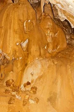 Limestone formations on the wall of an underground cave. Stock Photos