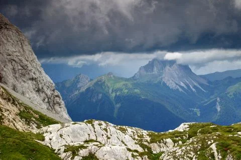 Limestone landscape under dark clouds in Carnic Alps, Italy Stock Photos