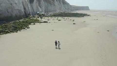 Limestone, moss rocks and 2 people on the beach (Cap Blanc Nez, France) d-log Stock Footage 116174611