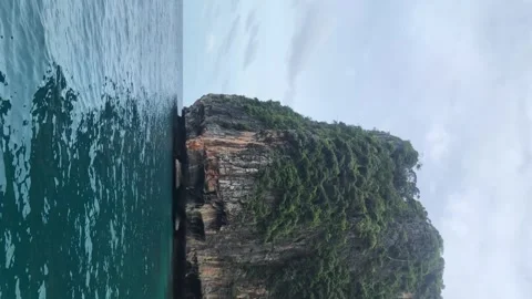 Limestone mountains in the middle of the sea Stock Footage 250933001