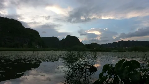 Limestone mountains sunset in Ninh Binh, Vietnam by the lake. Beautiful view Stock-Footage 155873017