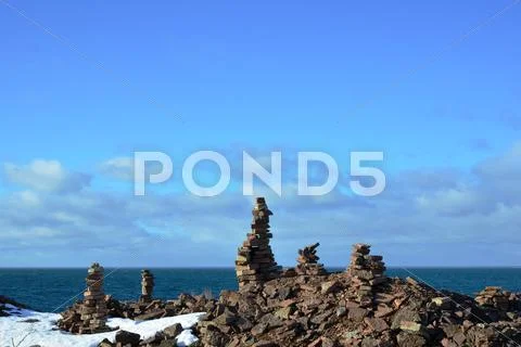 Limestone piles at coast Stock Photos