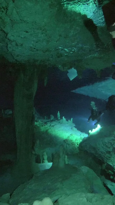 Limestone pillar below a low underwater cavern ceiling Stock Footage 341361518