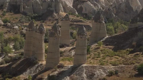 Limestone pillars with cone caps in Cappadocia valley Stock Footage 146612495