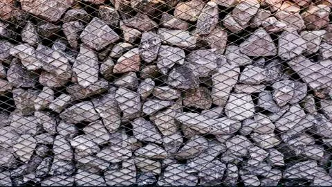 Limestone rock stack background, Rock stack with net barrier, Abstact backgro Stock Photos