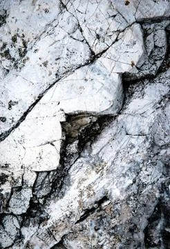 Limestone rock with a zigzag crack Stock Photos