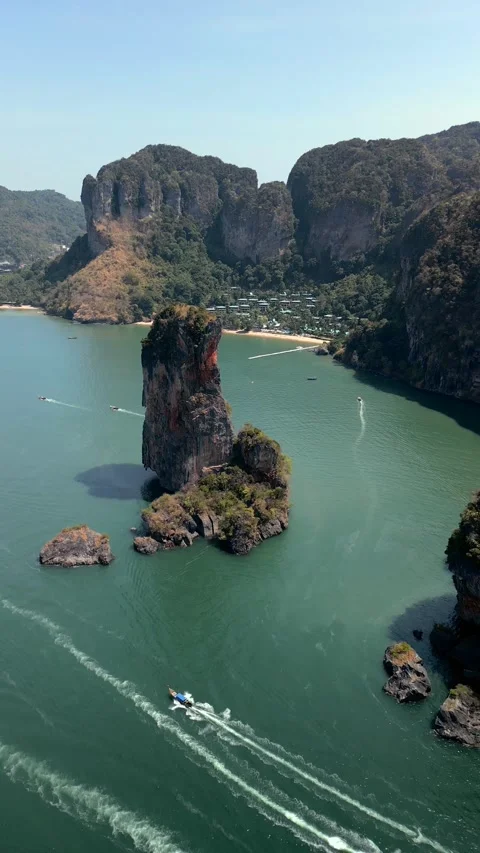 Limestone sea stack and tropical coastline near Ao Nang in Krabi Thailand Aerial Video stock 341081169