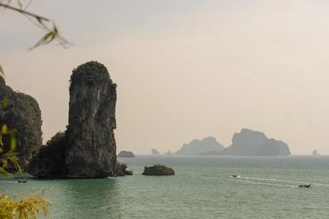 Limestone sea stack rising from Andaman Sea Photos