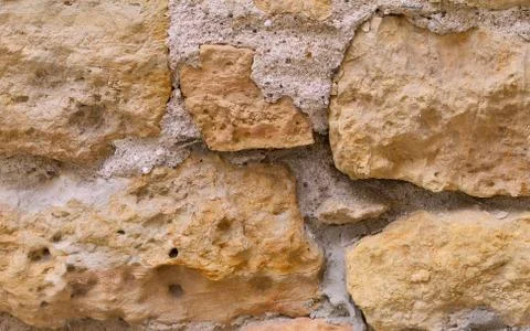 Limestone wall with cement as a background Stock Photos