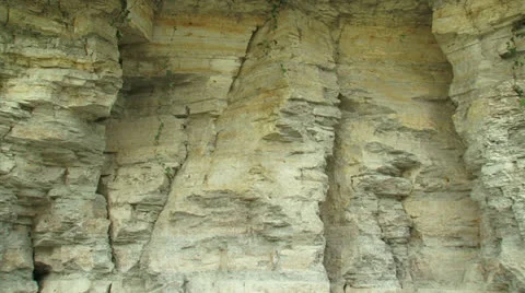 Limestone wall in quarry full screen + pan overgrown slope Stock Footage 22526746