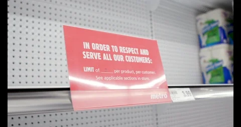 Limit of 2 per product sign on Empty Toilet Paper Aisle during Covid-19 Stockbeeldmateriaal 127208872