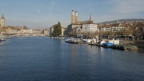 Limmat River flowing through the centre of Zurich towards the Grossmünster Stock Footage 122406713