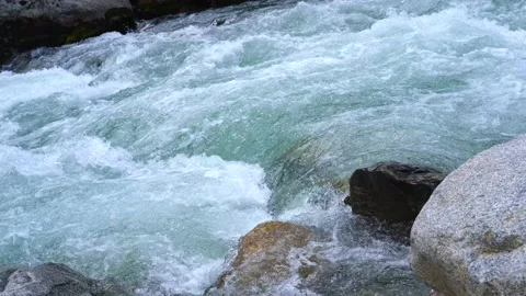 Limpid water of a high mountain stream running on rocks Stock Footage 166220595