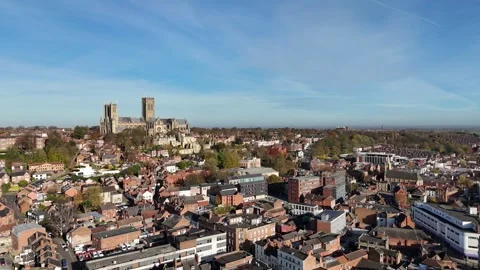 Lincoln England pull back drone aerial reverse reveal city centre Stock Footage 293244738