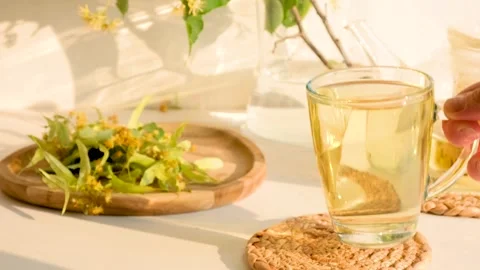 Linden tea in a transparent cup Stock Footage 256606538