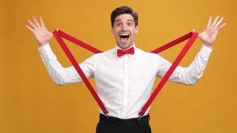 Lindy guy pull suspenders isolated on yellow shine color background 動画素材 165397532