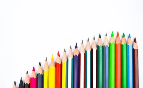 Line according to size of some different color wood pencil crayon on a white Foto stock